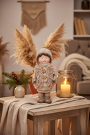 Meisje met bodywarmer - decoratiepop 35 cm